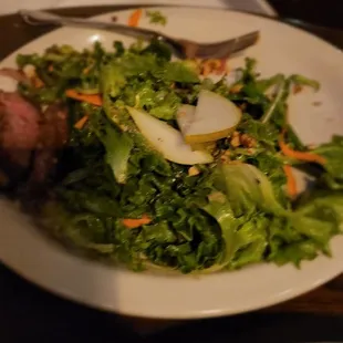 Steak Salad  Steak sirloin, organic greens, pickled red onion, pear, candied hazelnuts blood orange truffle vinaigrette