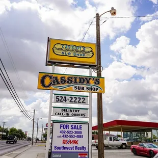 a sign for a sub shop