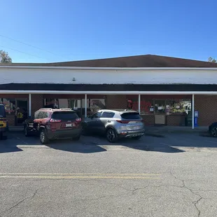cars parked in front of the restaurant