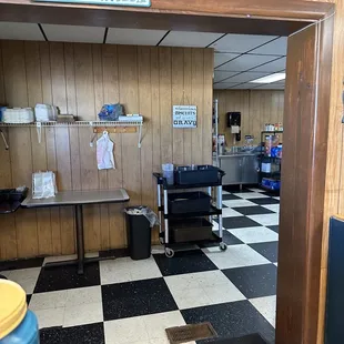 a kitchen with a checkered floor
