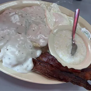 Double biscuit and gravy with grits eggs and bacon