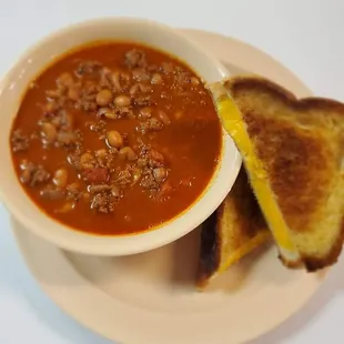 a bowl of soup and a grilled cheese sandwich