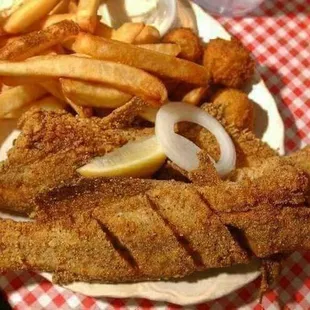 a plate of fried fish and french fries