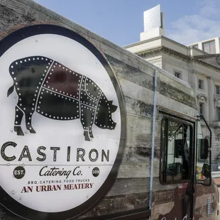 a sign on the side of a food truck