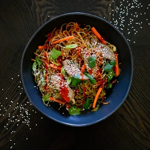 a bowl of noodles and vegetables
