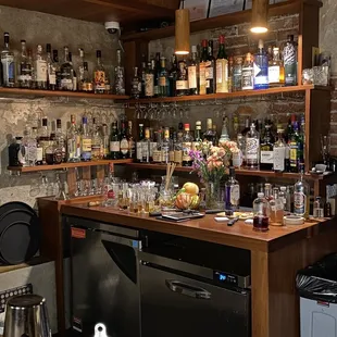 a bar with a lot of bottles of alcohol
