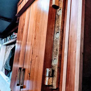 Fragrances for cocktail pairing are kept behind these doors.