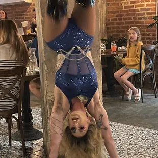 a woman doing a handstand