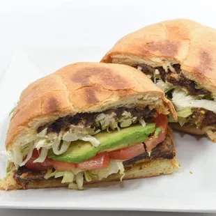 a sandwich cut in half on a plate