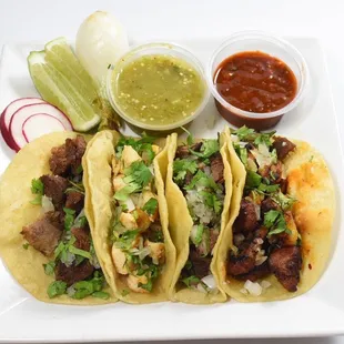 a plate of tacos and salsa