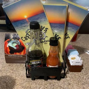 a bottle of hot sauce and a box of hot sauces