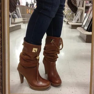 This customer is thrilled with her Michael Kors boots she found at Castaways!