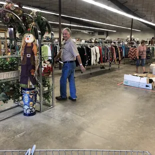 The man who made us put our belongings away but did nothing to the other shopper with a bag bigger than ours.