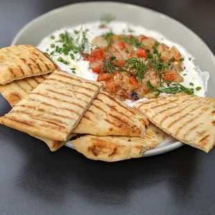 Roasted vegetables with yogurt dip and naan bread