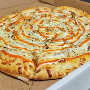 a pizza in a cardboard box