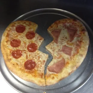 broken heart shape pizza. castellos pizza