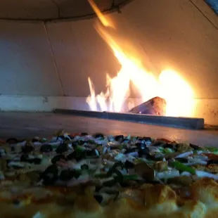 Supreme pizza. open Fire - brick oven
