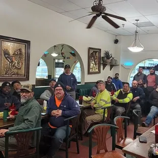 a group of people sitting in a restaurant