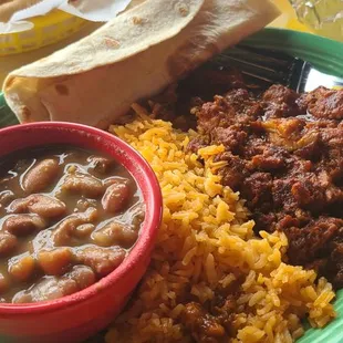 Puerco Rojo served with rice, charro beans and tortillas.