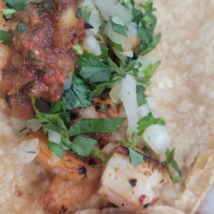 Shrimp tacos.  Raw tortilla.