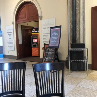 ATM next to the Castle Cafe seating area outside the Castle Cafe