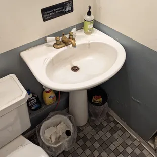 a sink and toilet in a small bathroom