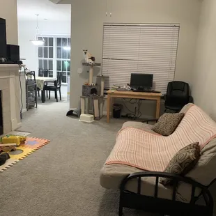 general view of living room and dining area.