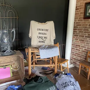 a bed with t - shirts on it
