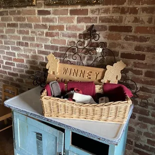 a table with a basket of wine