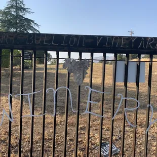 a fence with writing on it