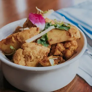 a bowl of fried tofu
