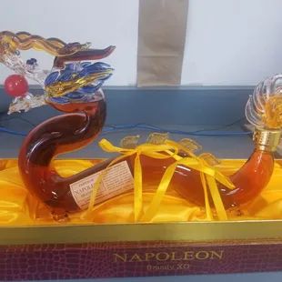 a bottle of liquor and a pipe