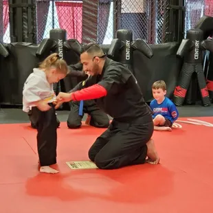 Earning her white/yellow belt.