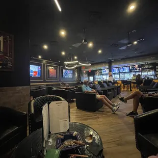 people relaxing in lounge chairs