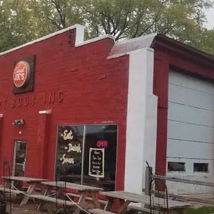 a red building with white trim