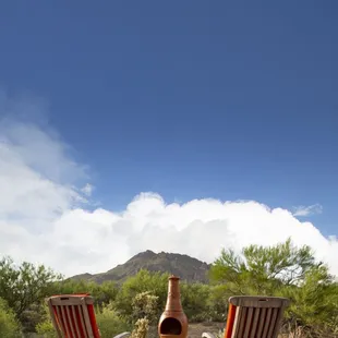 Outdoor patio with chimenea and a view of Cat Mountain