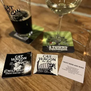 a glass of wine and coasters