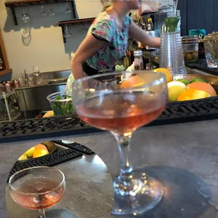 a woman preparing a drink