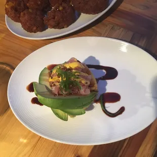 A Peruvian potato dish with avocado and gulf fish