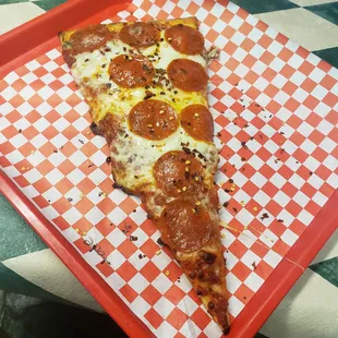 a slice of pepperoni pizza