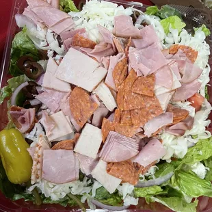 a salad in a plastic container