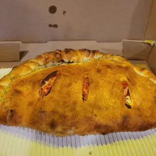 Large Manhattan calzone. I swear that they used to be bigger. Not cheap at $27. No sauce included?