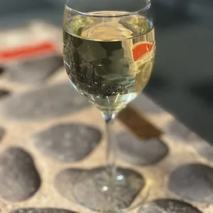 a glass of wine on a table