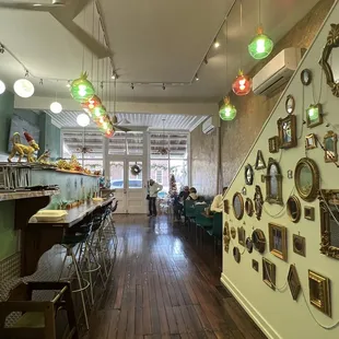 a cafe with a lot of pictures on the wall