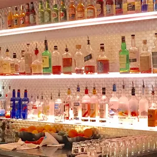 a variety of alcohol bottles on shelves