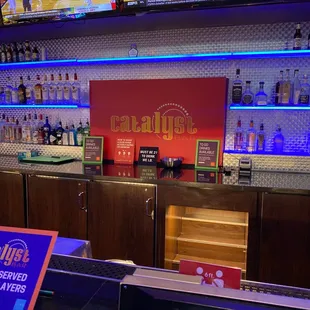 a laptop and televisions in the background