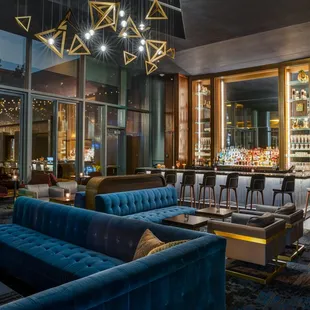 a bar and lounge area in a hotel