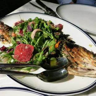 Whole roasted branzino (fish)