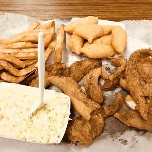 a plate of fried fish, fries, coleslaw and coleslaw