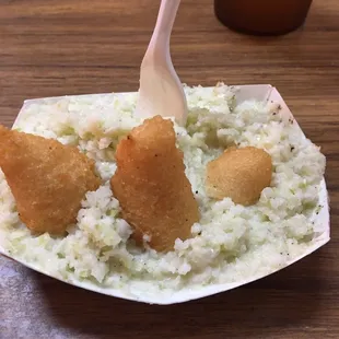 This is one of my favorite ways to eat the hush puppies &amp; slaw. Break/bite them apart and soak up slaw with them.